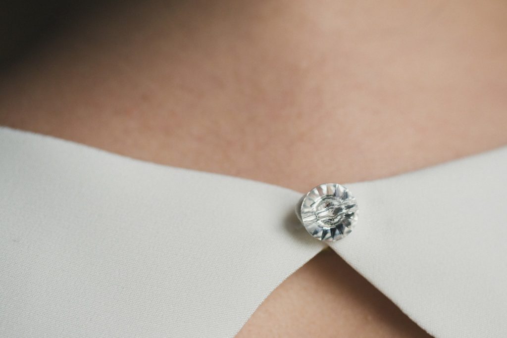 Crystal button closure on the keyhole back of the Heathe wedding dress