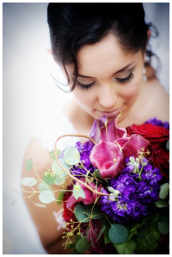 Portrait of bridal designer Lourdes Castaneda with her bouquet on her wedding day in Austin Texas
