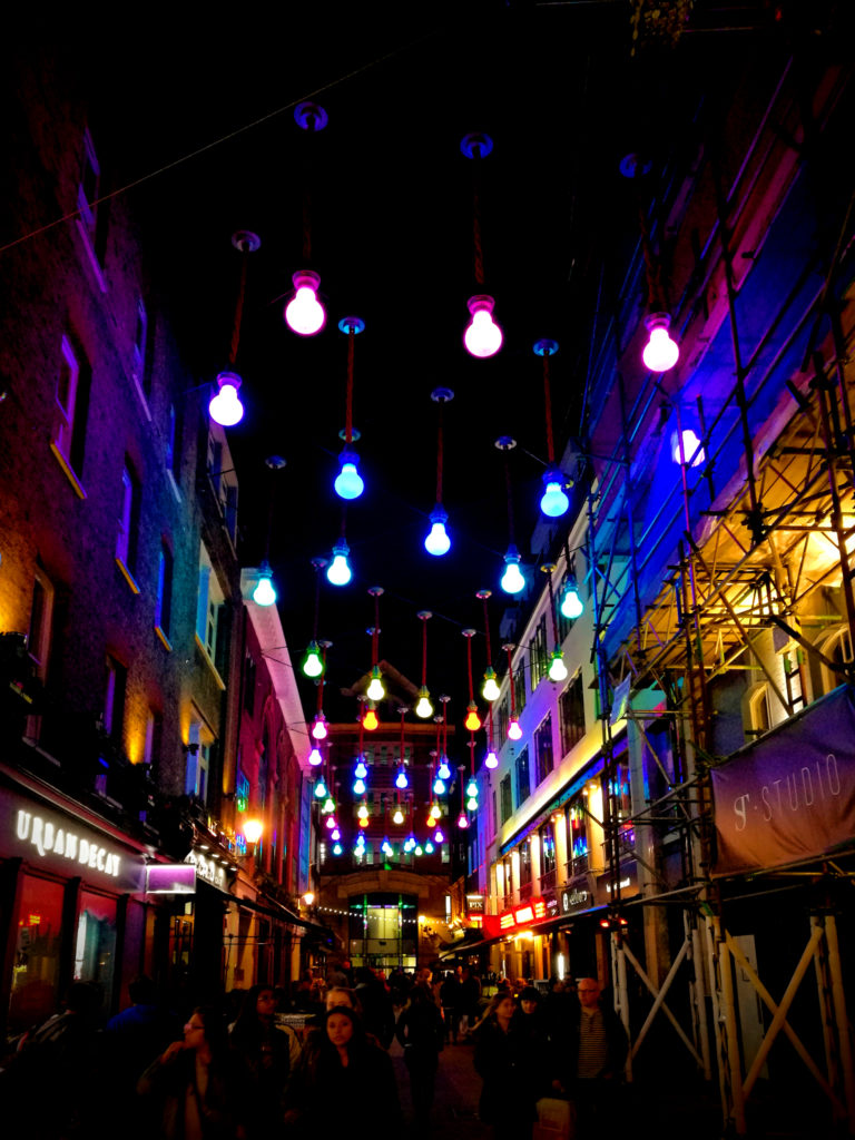 Carnaby Street at night decorated with colorful lights