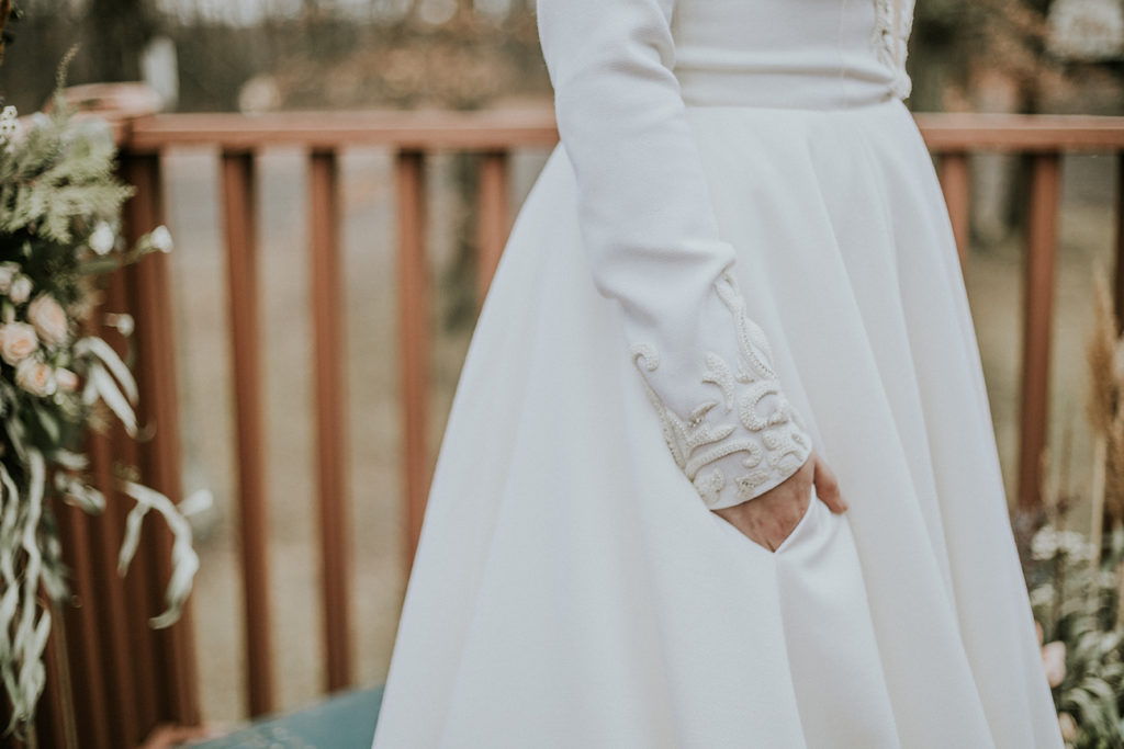 Pocket detail shot of the Iman long sleeve ballgown wedding dress by Edith Elan
