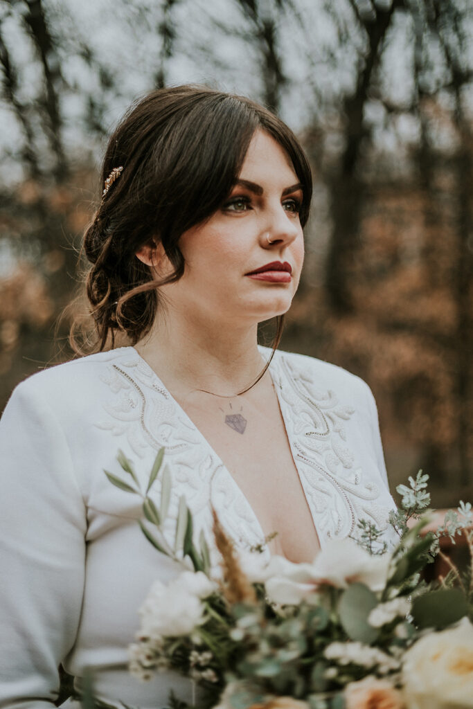 Earthy bridal makeup paired with the Iman ballgown wedding dress for a fall camp wedding.