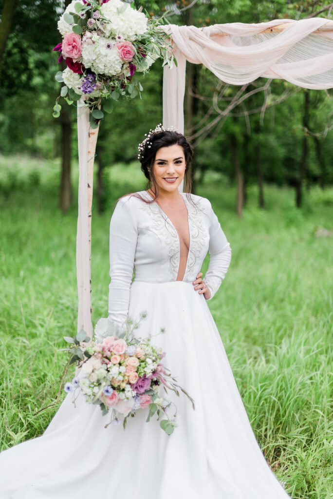 Fresh bridal makeup paired with the Iman ballgown wedding dress for an outdoor spring nature wedding.