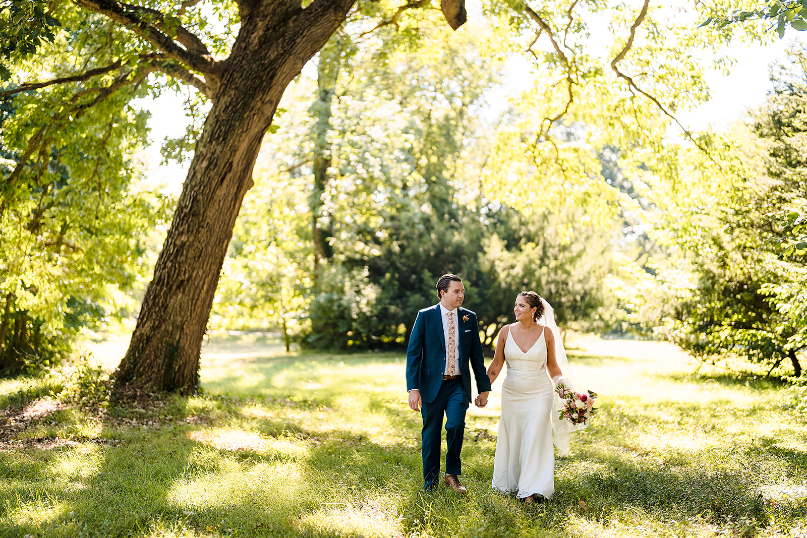 Bride and groom portrait on the wooded grounds of Awbury Arboretum in Philadelphia PA