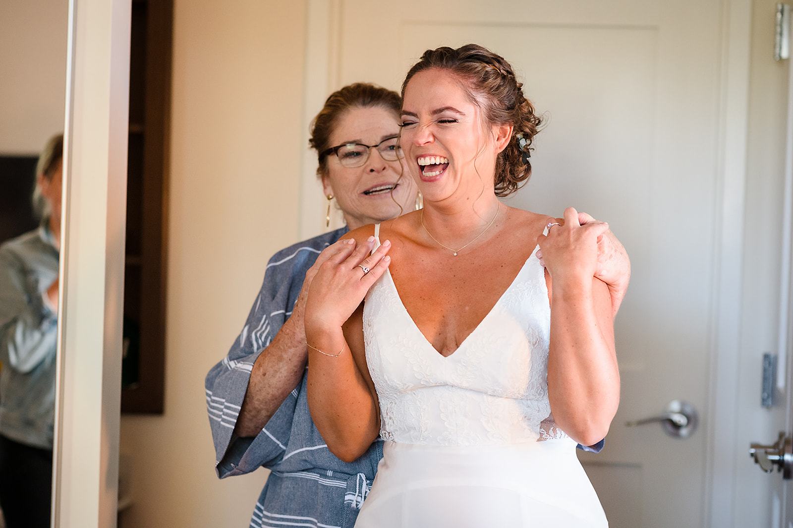 Bride getting ready with the help of her mom