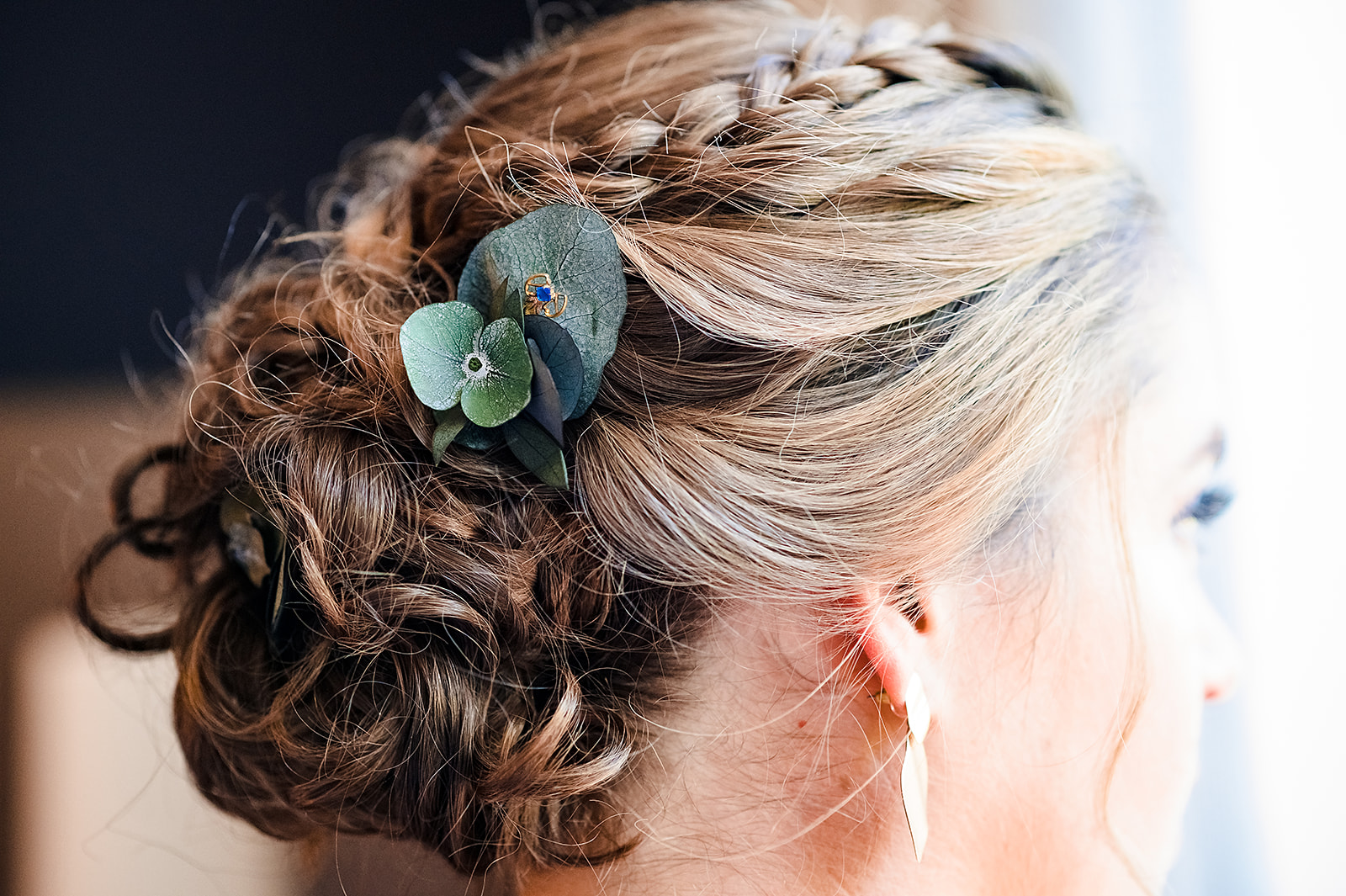 Romantic boho inspired bridal hairstyle with preserved floral pins and a touch of something blue