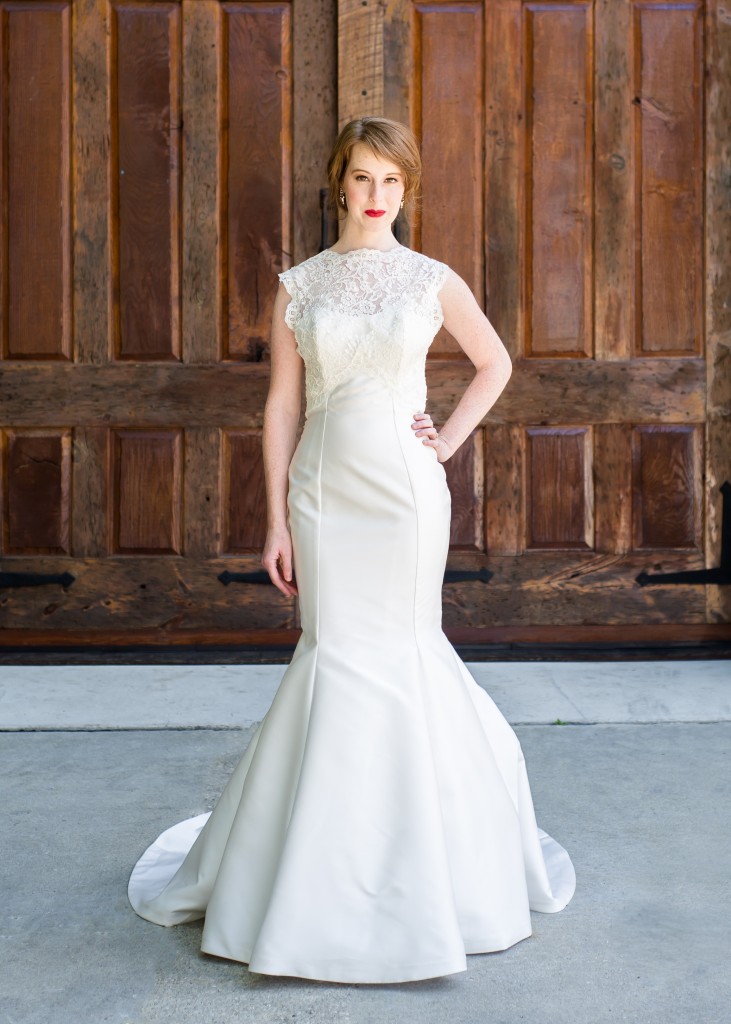 Amaia is a mikado fit and flare wedding dress with a lace topper bodice featuring a bateau neckline and keyhole back.