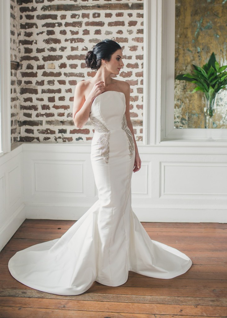Camellia by Edith Elan is a vintage glam wedding dress style. The strapless column silhouette features a full fishtail train.