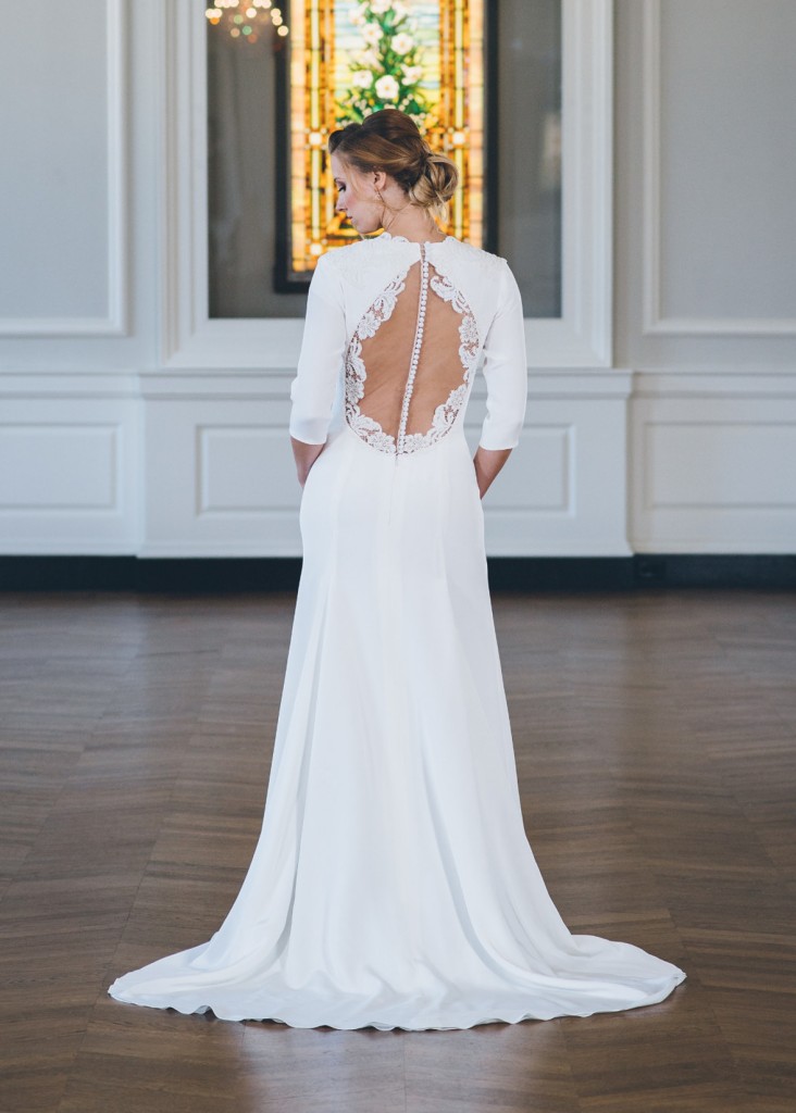 Leyla is a silk crepe wedding gown with a keyhole illusion back bodice and high neck.
