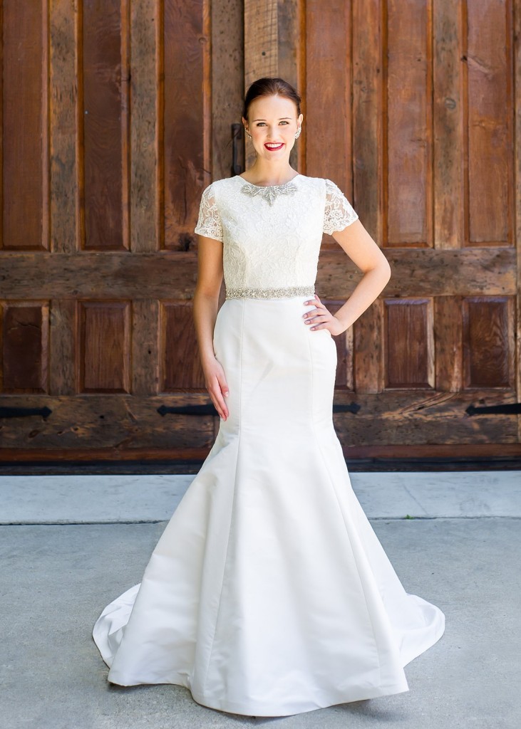 Mara by Edith Elan is a fit and flare wedding dress with a short sleeve lace bodice and mikado skirt.