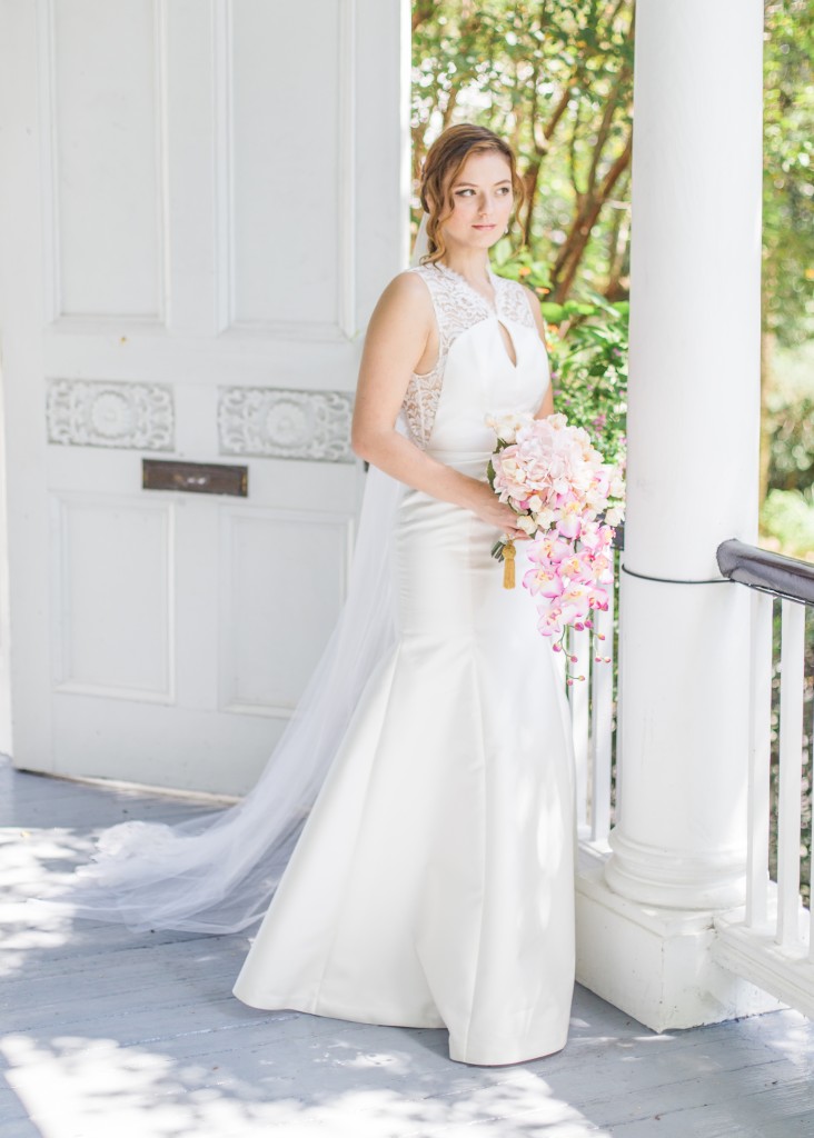 Whittaker is a fit and flare mikado wedding dress. The bodice has a small keyhole on the front and a larger keyhole back framed by lace.