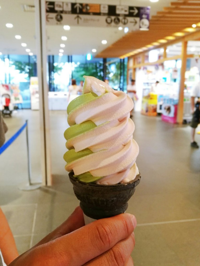 Vanilla and matcha swirl soft serve in a black sesame cone.