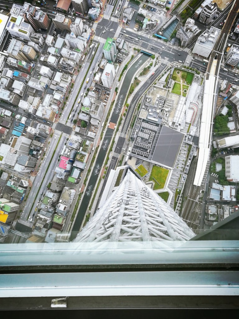 View of the street through the Tokyo Skytree glass floor.