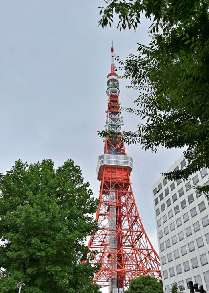 The red and white striped Tokyo Tower seen from a distance.