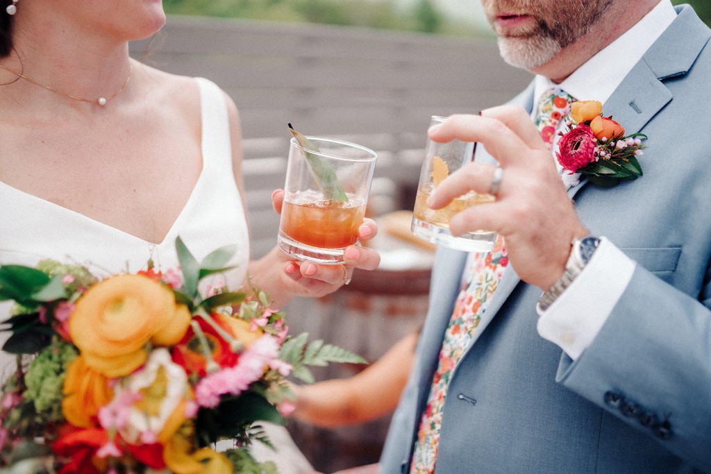 The bride and groom enjoying cocktails during their cocktail hour