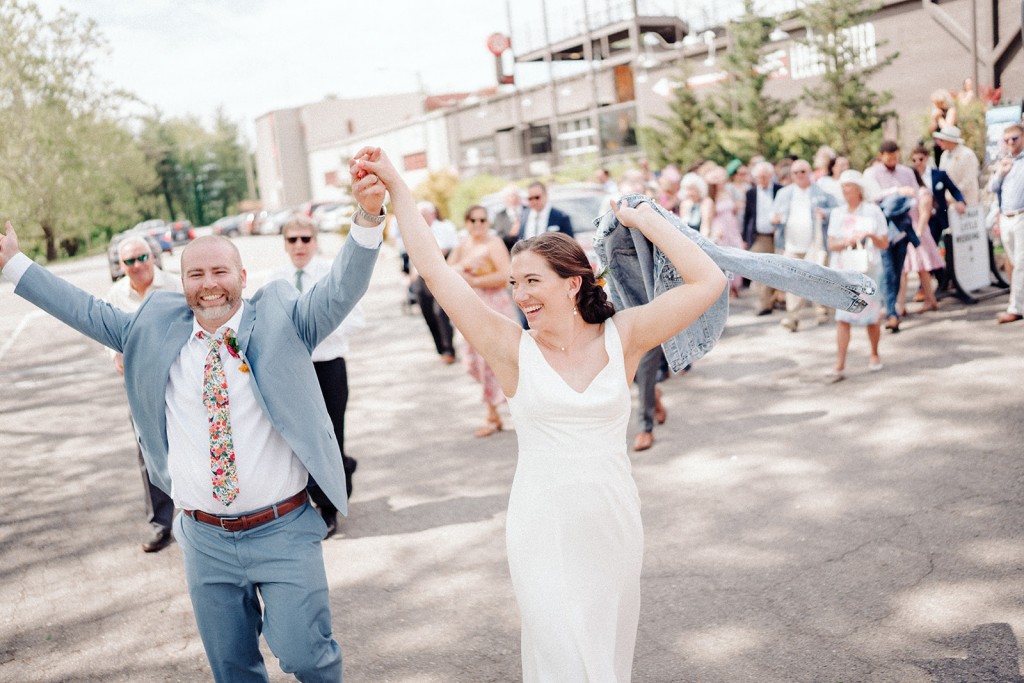 Fun photo of the wedding party as they head outdoors to the Highland Brewing beer garden.