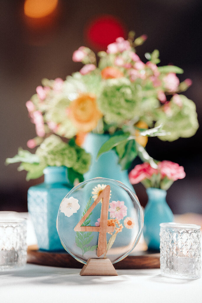 Colorful table centerpieces for an Asheville brewery wedding
