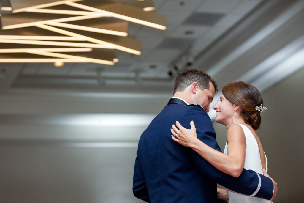 Military bride and groom during their first dance