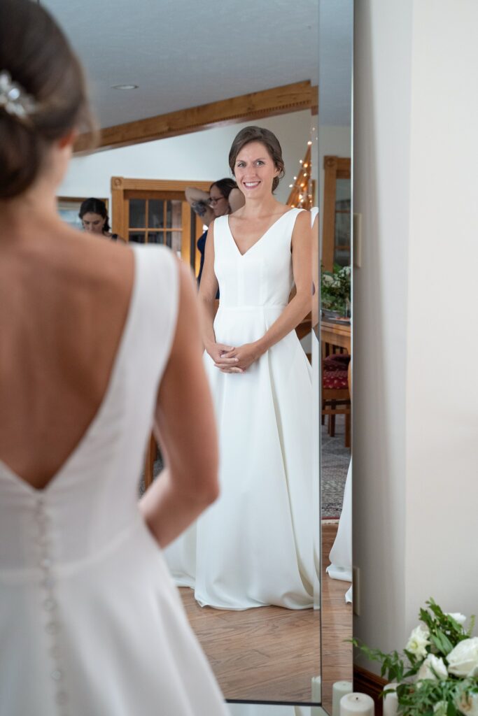 Bride in her silk crepe bespoke wedding gown by Edith Élan