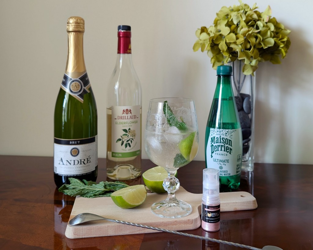 The Sparkling Spritz - a Hugo Spritz cocktail variation by Edith Élan with edible glitter.