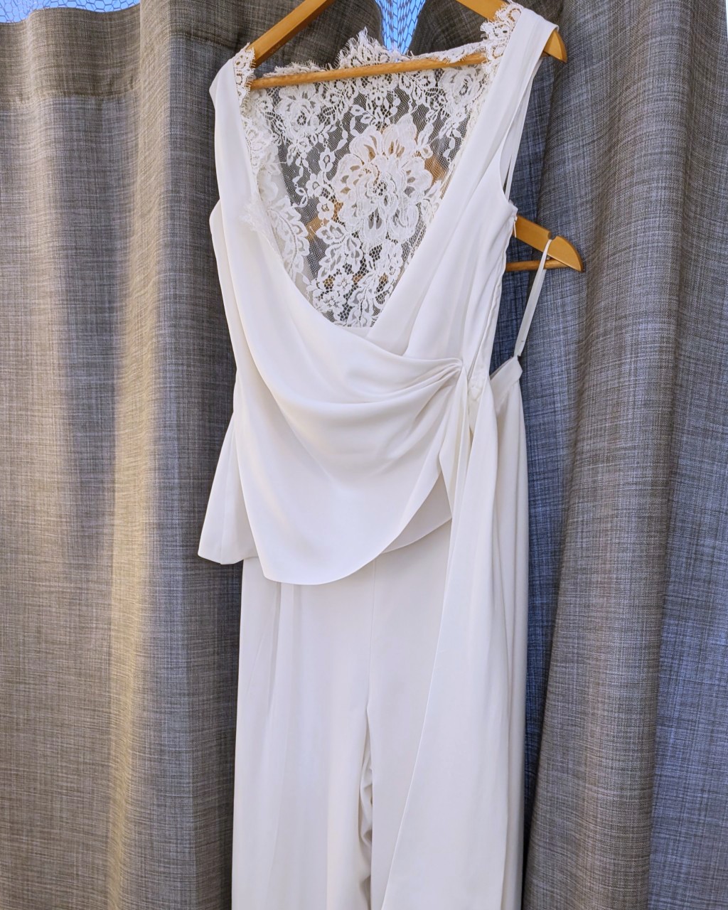 Custom bridal design process: final fitting of a two-piece bridal jumpsuit.